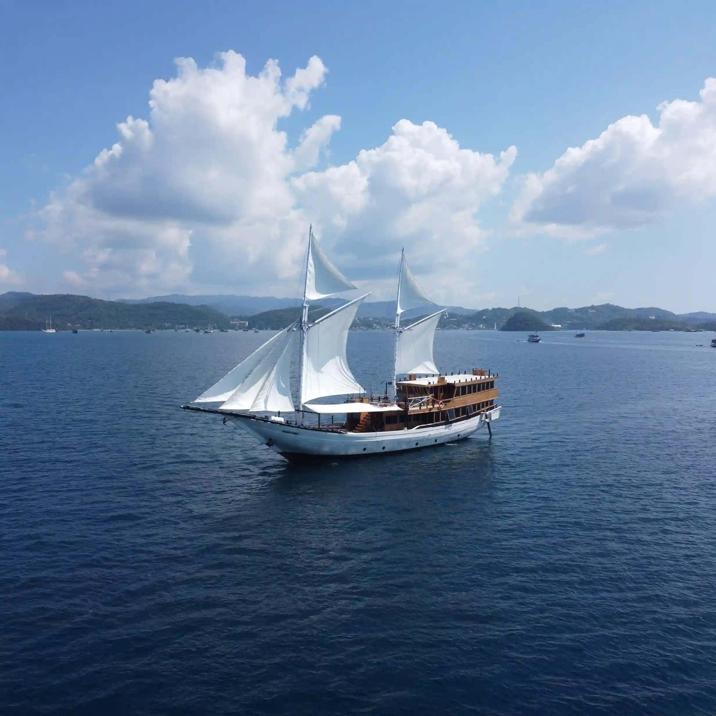 Traditional phinisi liveaboard boat sailing near Labuan Bajo
